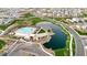 Aerial view of a community featuring a clubhouse, pool, pond with a fountain, playground, and walking paths at 1464 E Aris Dr, Gilbert, AZ 85298
