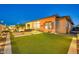 Well-maintained backyard featuring artificial grass and an inviting pool area at 1464 E Aris Dr, Gilbert, AZ 85298