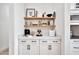 Convenient bar area with floating shelves and storage space at 1464 E Aris Dr, Gilbert, AZ 85298