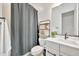 Contemporary bathroom featuring modern fixtures, patterned tile flooring, and a shower with a dark curtain at 1464 E Aris Dr, Gilbert, AZ 85298