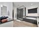 Elegant bathroom with a glass-enclosed shower, a soaking tub, and sleek black and white herringbone tile accents at 1464 E Aris Dr, Gilbert, AZ 85298