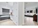 Well-lit bathroom with a soaking tub, sleek cabinets, and access to a cozy seating area with natural light at 1464 E Aris Dr, Gilbert, AZ 85298