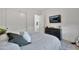 Stylish bedroom boasts a wall-mounted TV and a sleek black dresser at 1464 E Aris Dr, Gilbert, AZ 85298