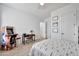 Bright bedroom featuring a bed, a desk, and an arcade game for entertainment at 1464 E Aris Dr, Gilbert, AZ 85298