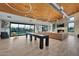 Stylish clubhouse featuring a shuffleboard table, comfortable seating, and modern lighting at 1464 E Aris Dr, Gilbert, AZ 85298