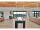 Bright community clubhouse with shuffleboard table and comfortable lounge areas for residents to enjoy at 1464 E Aris Dr, Gilbert, AZ 85298