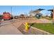 A yellow fire hydrant stands in a community park area next to a food truck at 1464 E Aris Dr, Gilbert, AZ 85298