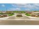Impressive community entrance featuring stone signage, manicured landscaping, and a welcoming water feature at 1464 E Aris Dr, Gilbert, AZ 85298