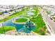 Aerial shot of community park with walking trails, water features, play areas, and lush greenery at 1464 E Aris Dr, Gilbert, AZ 85298