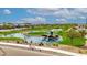 Community park featuring picturesque ponds, walking paths, a central fountain, and plenty of green space at 1464 E Aris Dr, Gilbert, AZ 85298