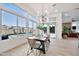 Bright dining area with view to the backyard pool area through large picturesque windows at 1464 E Aris Dr, Gilbert, AZ 85298