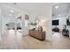 Bright entryway featuring a decorative console table and a glimpse into the open-concept living spaces at 1464 E Aris Dr, Gilbert, AZ 85298