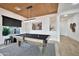 Elegant game room showcasing a billiards table with wood trim ceiling and natural lighting at 1464 E Aris Dr, Gilbert, AZ 85298