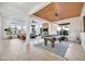Bright, open game room features a pool table, wood ceiling and view to the living room at 1464 E Aris Dr, Gilbert, AZ 85298