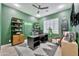 Stylish home office with green walls, contemporary decor, and modern shelving for an inspiring workspace at 1464 E Aris Dr, Gilbert, AZ 85298