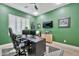 Well-appointed home office with sleek furniture, modern decor, and a comfortable layout for efficient work from home at 1464 E Aris Dr, Gilbert, AZ 85298