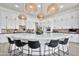 Bright kitchen with a large center island, white cabinetry, pendant lighting, and stainless steel appliances at 1464 E Aris Dr, Gilbert, AZ 85298
