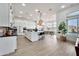 Spacious open-concept kitchen with an island, stainless steel appliances, and seamless integration with the dining area at 1464 E Aris Dr, Gilbert, AZ 85298