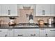 Gourmet kitchen featuring gas cooktop and stylish mosaic tile backsplash at 1464 E Aris Dr, Gilbert, AZ 85298