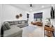Cozy living room featuring a comfortable sectional sofa, stylish decor, and ample natural light for relaxation at 1464 E Aris Dr, Gilbert, AZ 85298
