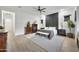 Spacious main bedroom with a feature wall, modern furnishings, and ample natural light at 1464 E Aris Dr, Gilbert, AZ 85298