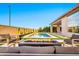 Inviting pool area with a cozy fire pit and comfortable lounge seating at 1464 E Aris Dr, Gilbert, AZ 85298
