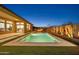 Beautiful backyard pool with fire pit, cacti, and ample space for entertaining on the patio and in the yard at 1464 E Aris Dr, Gilbert, AZ 85298