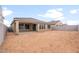 Spacious backyard with covered patio and ample space for outdoor living and entertaining at 17614 W Rancho Dr, Litchfield Park, AZ 85340