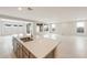 Kitchen island with stainless steel sink and quartz countertops at 17614 W Rancho Dr, Litchfield Park, AZ 85340