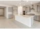 New kitchen with island, grey cabinets, stainless appliances, and recessed lighting at 17614 W Rancho Dr, Litchfield Park, AZ 85340