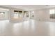 Bright, spacious living room featuring tile flooring and large windows at 17614 W Rancho Dr, Litchfield Park, AZ 85340