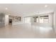 Open-concept living space with kitchen, tile floors, and plenty of natural light at 17614 W Rancho Dr, Litchfield Park, AZ 85340