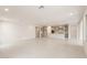 Bright open-concept living area with tile flooring, open floor plan, and recessed lighting at 17614 W Rancho Dr, Litchfield Park, AZ 85340