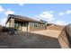 Home's backyard with covered patio, offering ample space for outdoor activities and potential landscaping at 17821 W Getty Dr, Goodyear, AZ 85338