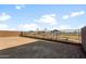 A view of the backyard, adjacent to a community playground at 17821 W Getty Dr, Goodyear, AZ 85338