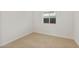 Small, carpeted bedroom is clean and bright with a small window and electrical outlets on the walls at 17821 W Getty Dr, Goodyear, AZ 85338