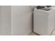 Modern laundry room with white washer and dryer units for convenient laundry tasks at 17821 W Getty Dr, Goodyear, AZ 85338