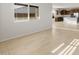 Bright empty room with a window and carpeted flooring at 17821 W Getty Dr, Goodyear, AZ 85338