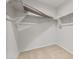 Spacious walk-in closet with shelving to maximize storage and organization at 17821 W Getty Dr, Goodyear, AZ 85338