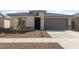 Charming single-story home features a stucco exterior, stone accents, and a well-maintained front yard at 17845 W Getty Dr, Goodyear, AZ 85338