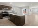 Stylish kitchen with a granite island, stainless steel appliances, and ample cabinet space at 17845 W Getty Dr, Goodyear, AZ 85338