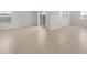 Open-concept living space with tile flooring and large windows at 17845 W Getty Dr, Goodyear, AZ 85338