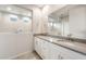 Stylish primary bathroom with double sinks, quartz countertop, and large framed shower at 17851 W Getty Dr, Goodyear, AZ 85338