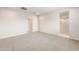 Neutral bedroom features carpet, recessed lighting, and open bathroom access at 17851 W Getty Dr, Goodyear, AZ 85338