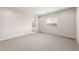 Bright bedroom features neutral carpet and an open en-suite bathroom at 17851 W Getty Dr, Goodyear, AZ 85338