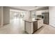 Modern kitchen featuring an island with stainless steel appliances and ample counter space at 17851 W Getty Dr, Goodyear, AZ 85338