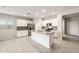 Modern open kitchen with granite countertops, stainless steel appliances, and ample cabinet space at 17851 W Getty Dr, Goodyear, AZ 85338