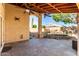 Covered back patio offers stunning views of the pool and meticulously landscaped backyard at 18525 N 85Th N Ave, Peoria, AZ 85382