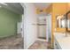 Spacious bathroom featuring a step-in shower, ceramic tile floors and bright, colorful walls at 18525 N 85Th N Ave, Peoria, AZ 85382