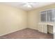 Bedroom with wood floors, a ceiling fan, and built-in storage at 18525 N 85Th N Ave, Peoria, AZ 85382